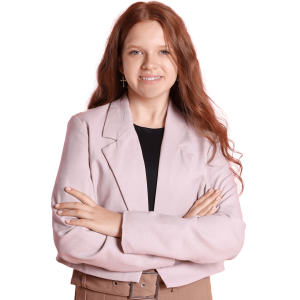 Female student in pink jacket with arms folded